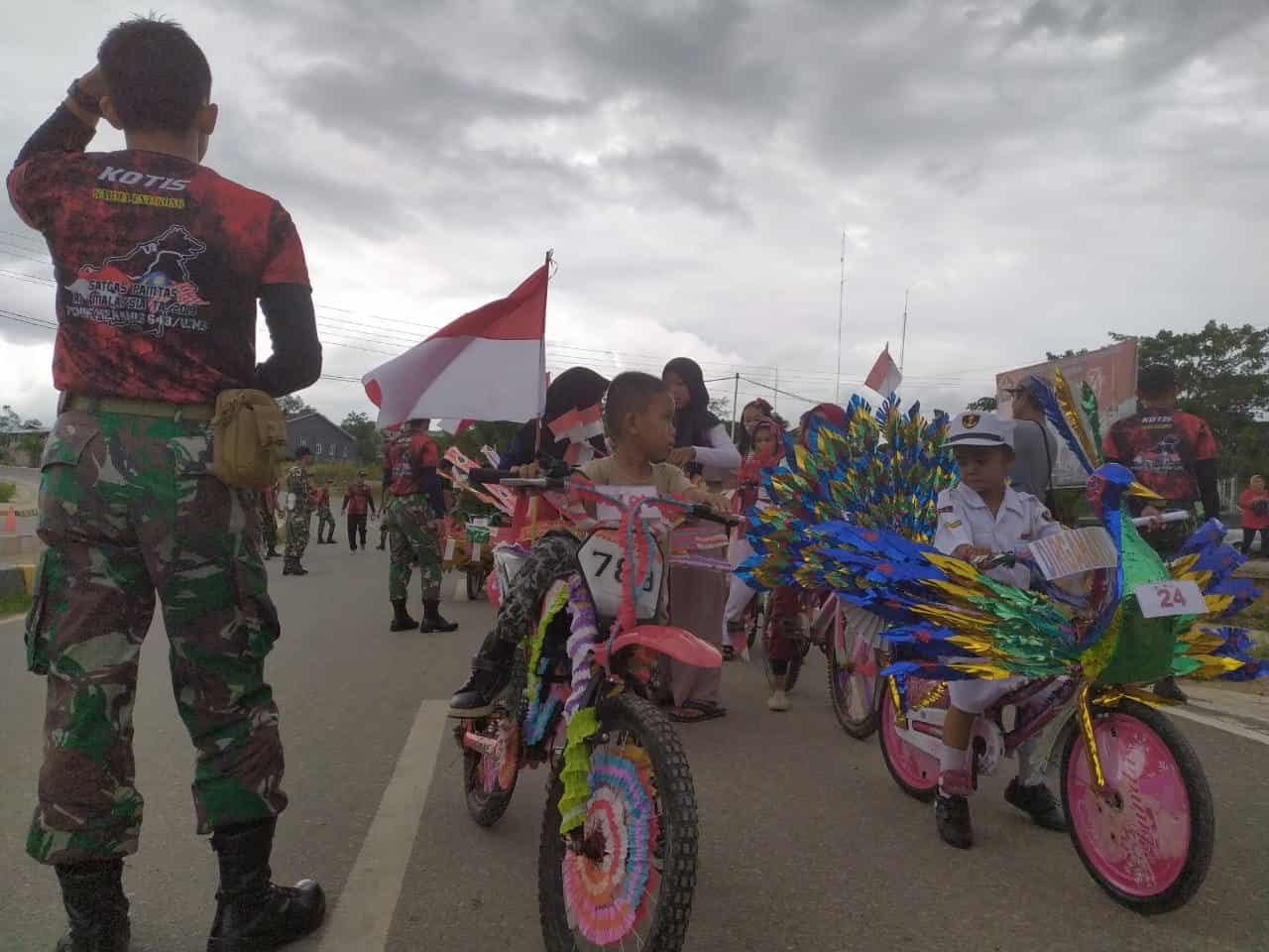 Meriahkan HUT TNI, Satgas Yonif 132 Gelar Lomba Anak dan Pengobatan Massa di Eban