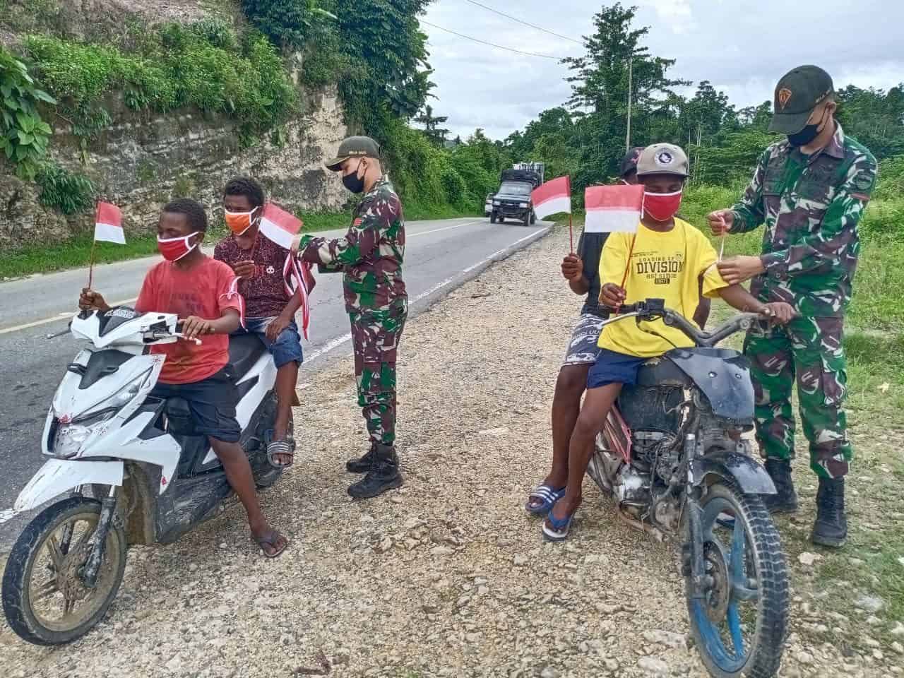 Semarakan HUT RI Ke 76, TNI Gelar Bakti Sosial dan Kibarkan Bendera Merah Putih Serentak di Papua