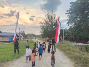 Satgas Yonif 131 Bersama Warga Merah Putihkan Jalan Kampung Gambut di Papua