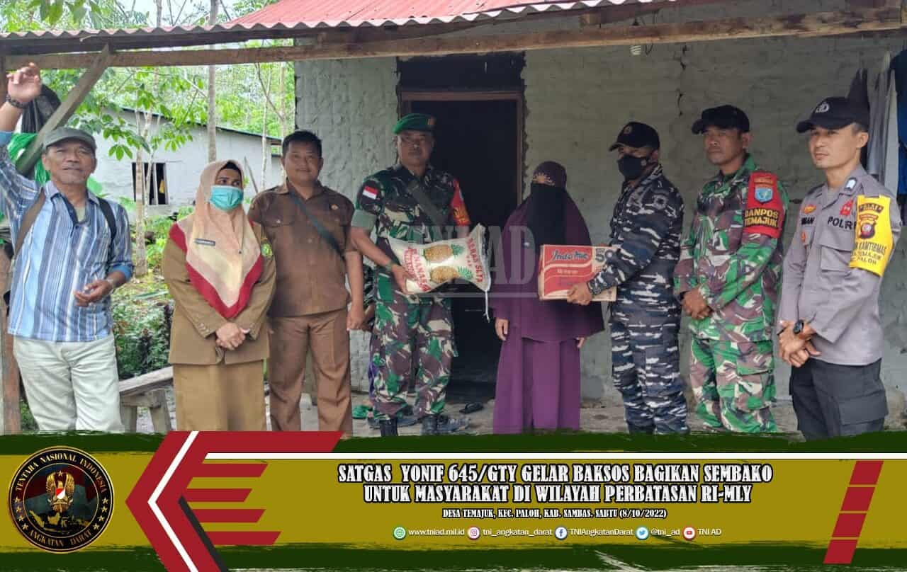 Satgas Yonif 645/GTY Gelar Baksos Bagikan Sembako Untuk Masyarakat di Wilayah Perbatasan RI-MLY