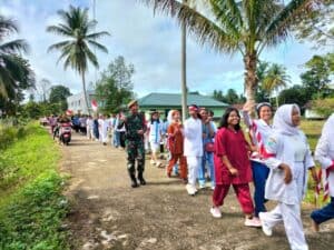 Peringati Hari Pahlawan, Satgas Yonarmed 19/105 Trk Bogani Pawai Budaya Di Perbatasan.