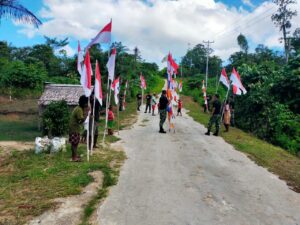 Satgas Yonif 623/BWU Bersama Warga, Merah Putihkan Jalan Kampung Bori di Papua