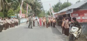 Danramil 03/Haruyan Lepas Gerak Jalan Peringati Hari Pramuka dan Sambut HUT ke-78 Kemerdekaan RI